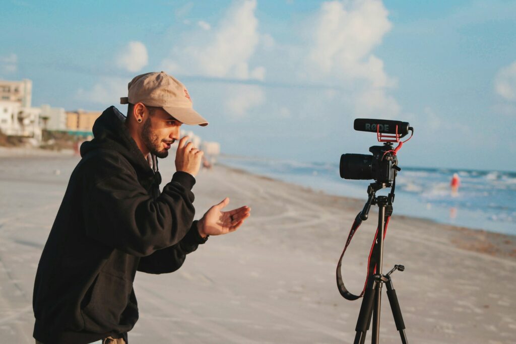 Man holding camera during daytime photo